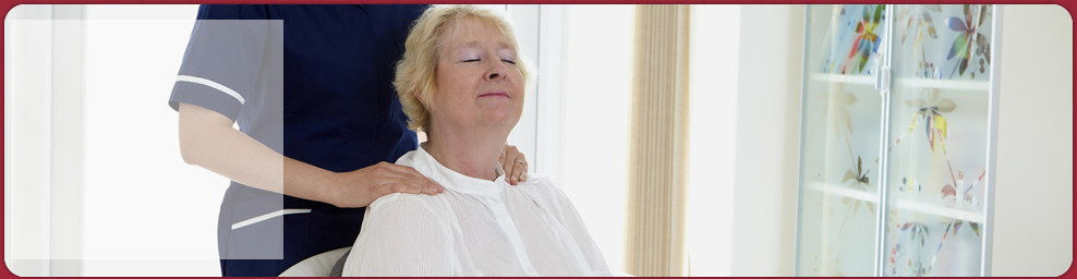 senior woman feeling relaxed with the caregiver's massage